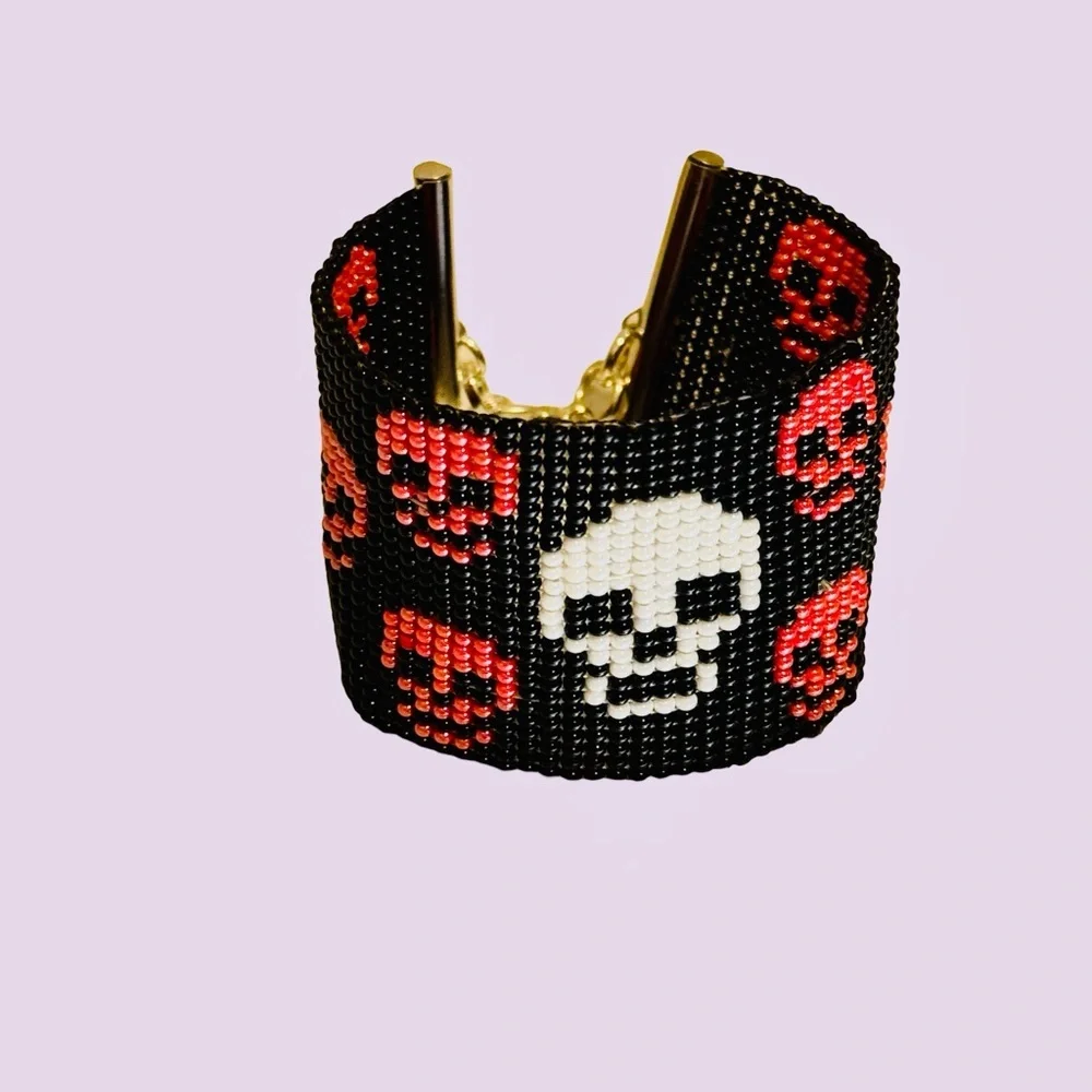 Handcrafted pink and white skulls on black seed bead bracelet adjustable